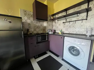a kitchen with a washing machine and a washer at Einstein apartment in Sofia