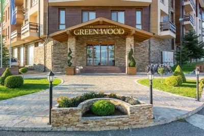 a building with a sign that reads the greenwood at Top floor and mountain views in Razlog