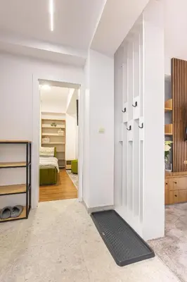 a room with a door leading to a bedroom at Mont Blanc Apartment in Bansko