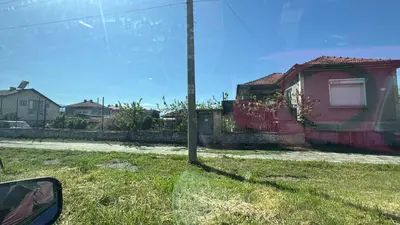 a pole in the grass next to a house at Pazardzhik Shelter House 3 Empty Rooms, No Electric, No Water, No WC, Free Car Parking, Glavinitsa Self Check-in