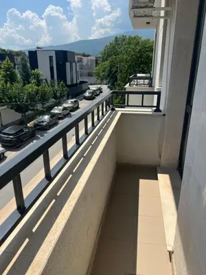 a balcony of a building with a view of a street at Cozy apartment, by Paradise Mall in Sofia