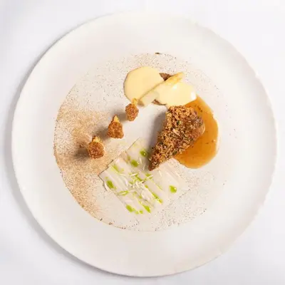 a white plate with food on a white table at Spacious 1BR Apartment in Central Sofia, Next to University in Sofia