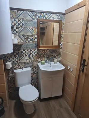 a bathroom with a toilet and a sink at Ego apartment Velingrad in Velingrad
