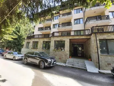 a black car parked in front of a building at Ego apartment Velingrad in Velingrad
