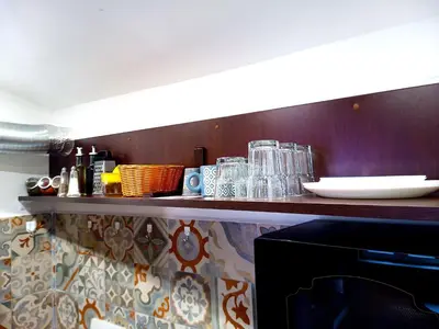 a shelf with glasses and other items on it at Jazzy Art Home - Top Center - plus Free Vouchers in Sofia