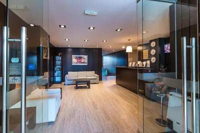 a living room with a couch and a table at Aspen Apartment A208 3OOm from Gondola in Bansko