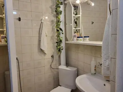 a small bathroom with a toilet and a sink at Apartament KETI улица Христо Максимов 56 вхВ in Sofia