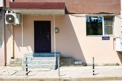 a house with a black door on a street at Top City Centre Apartment 122 in Sofia