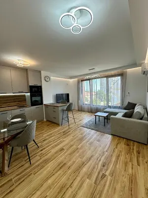 a living room with a couch and a table at D&G City Homes in Sofia