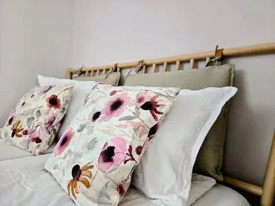 a bed with two pillows on top of it at Ma-Bebe PlayHouse with Private Sauna --- Lake, Parks and SPA Pools in 5 min in Pancharevo