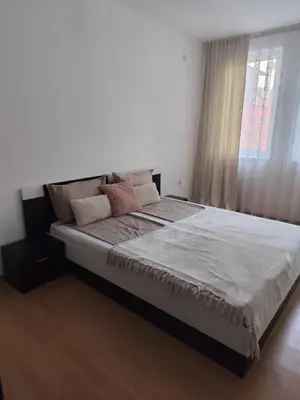 a large bed in a bedroom with a window at Guest House Amaya Riva in Plovdiv
