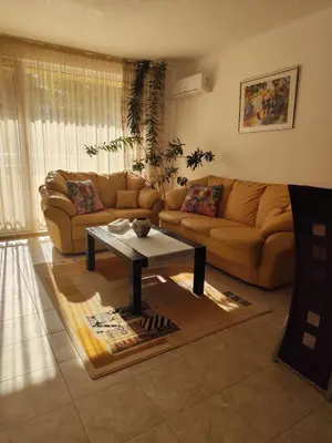 a living room with a couch and a coffee table at Guest House Amaya Riva in Plovdiv