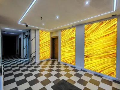 a room with yellow walls and a checkered floor at White Peak 2rooms ap in Bansko