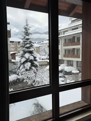 a view of a christmas tree from a window at Luxury Studio2 in Hotel Friends in Bansko