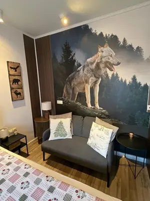 a living room with a wolf mural on the wall at Luxury Studio2 in Hotel Friends in Bansko