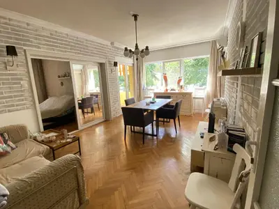 a living room with a couch and a table and chairs at Journalist squad in Sofia