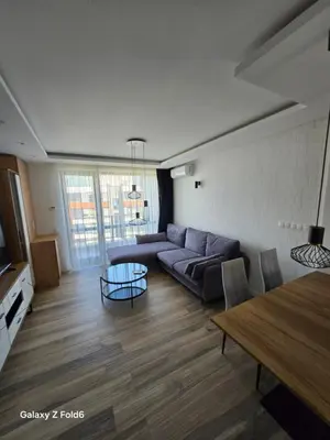 a living room with a couch and a table at Dilyanka 3 in Pernik