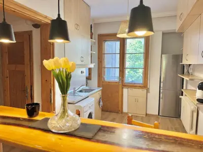 a kitchen with a vase of flowers on a counter at Boby Center Home in Sofia
