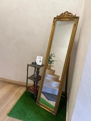 a mirror sitting on a floor next to a staircase at Just a Dream - guest apartments in Troyan