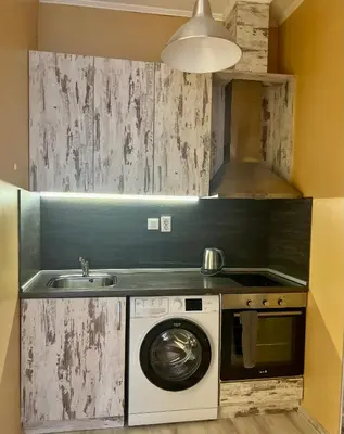 a kitchen with a washing machine and a sink at Flower house 1 in Sofia