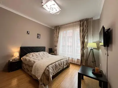 a bedroom with a bed and a window at Hamburg 100 Sq M 2BDR Family Apt near NDK and Vitosha BLVD in Sofia