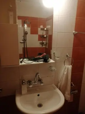 a bathroom with a sink and a mirror at Комфортен апартамент, безплатно гараж! in Sofia