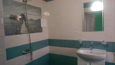 a bathroom with a sink and a mirror at Стаи за гости Деметра in Sofia