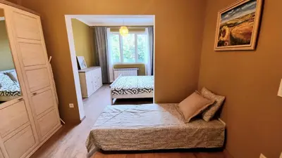 a small bedroom with a bed and a window at No X - Sofia top center in Sofia