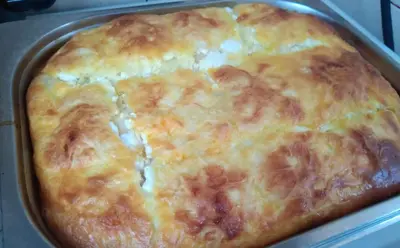 a close up of a cheese pizza in a pan at Stay with Me Women only room parking childrens pets welcom in Sofia