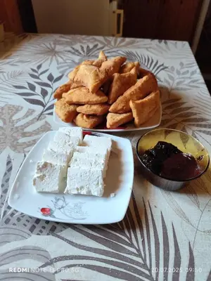 a plate of food with a slice of cake and bread at Stay with Me Women only room parking childrens pets welcom in Sofia