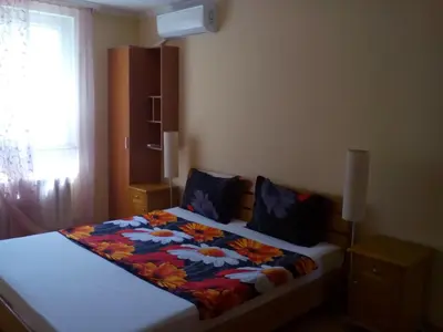 a bedroom with a bed with a colorful blanket on it at Stay with Me Women only room parking childrens pets welcom in Sofia