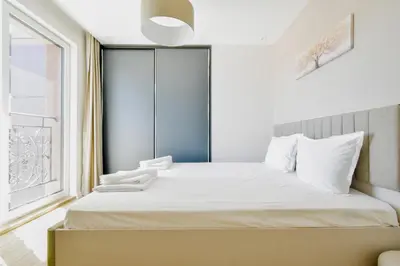 a bedroom with a bed and a window at Modern 1BD Near Paradise Center & Vitosha Metro by Flat Manager in Sofia