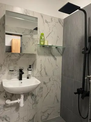 a bathroom with a sink and a mirror at Sofia City Quiet Retreat in Sofia