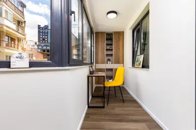 a small office with a yellow chair in front of a window at Two Stylish 1BD Apartments with Desk in Karshiaka by Flat Manager in Plovdiv