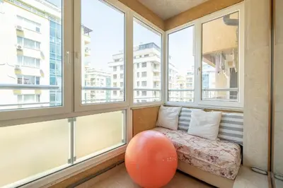 a room with windows with an orange ball in front of it at Modern Apartment - Top Location - Friendly Host by Flat Manager in Sofia