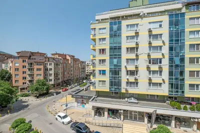 an apartment building in a city with a street at Modern Apartment - Top Location - Friendly Host by Flat Manager in Sofia