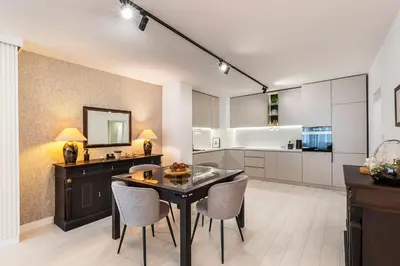 a kitchen with a table and chairs in a room at D-home in Sofia