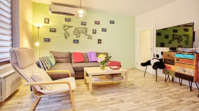 a living room with a couch and a table at City Nest 1BD in Lozenets by Flat Mаnager in Sofia