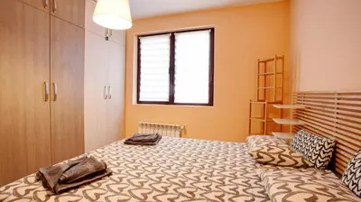 a bedroom with a bed and a window at City Nest 1BD in Lozenets by Flat Mаnager in Sofia