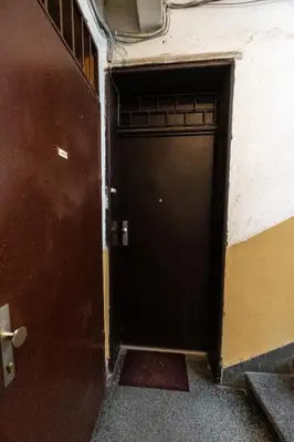 a black door in a room with a wall at Sofique 3BR in Sofia