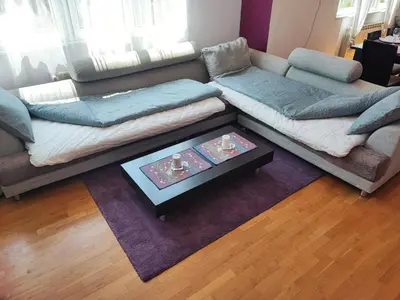 a living room with a couch and a coffee table at Simply The Best - Vitosha blvd in Sofia
