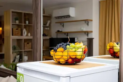 a bowl of fruit sitting on top of a table at Good Mood Apartments & Parking in Plovdiv