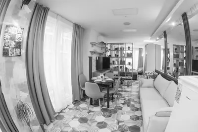 a living room with a couch and a table at Good Mood Apartments & Parking in Plovdiv