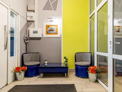 a room with two chairs and a table in a building at Winter Palace Vitosha View Studio in Sofia