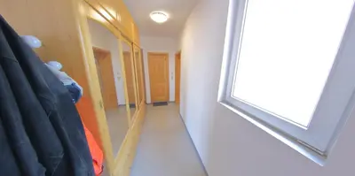 a dressing room with a mirror and a hallway at Spacious Penthouse Sofia in Sofia