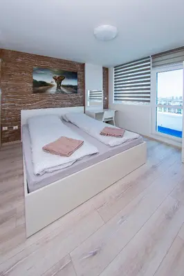 a bedroom with a large bed in a room at Easy studios in Sofia