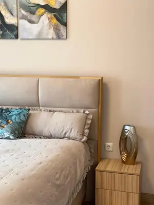 a bedroom with a bed and two paintings on the wall at Selena Apartment 50m to Metro with Free Parking in Sofia