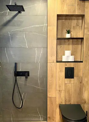 a bathroom with a toilet with a hose attached to the wall at Selena Apartment 50m to Metro with Free Parking in Sofia