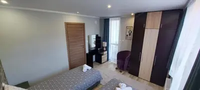 a small living room with a couch and a television at Stoykite view in Stoykite