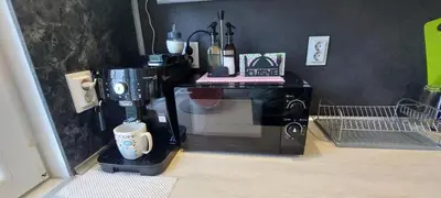 a coffee maker sitting on top of a microwave at Stoykite view in Stoykite